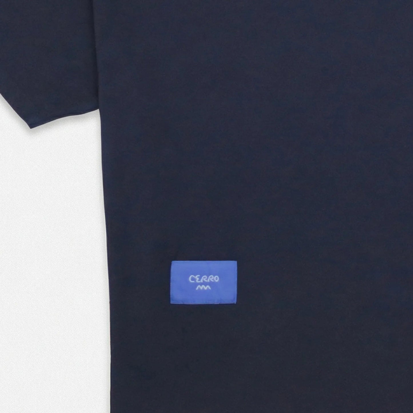 Navy blue t-shirt with a small blue logo on a white background