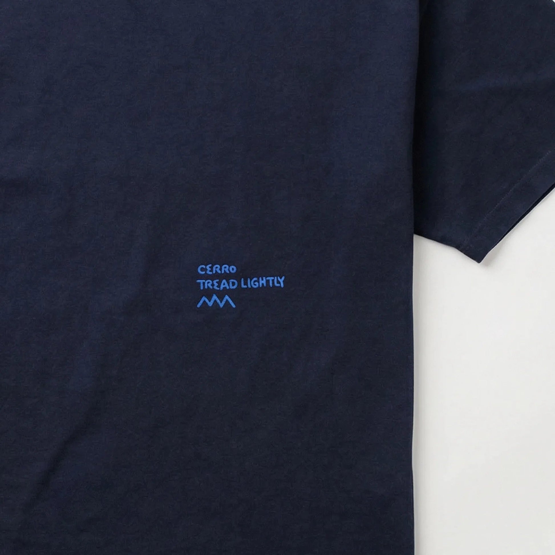 Navy blue t-shirt with a small blue logo on a white background