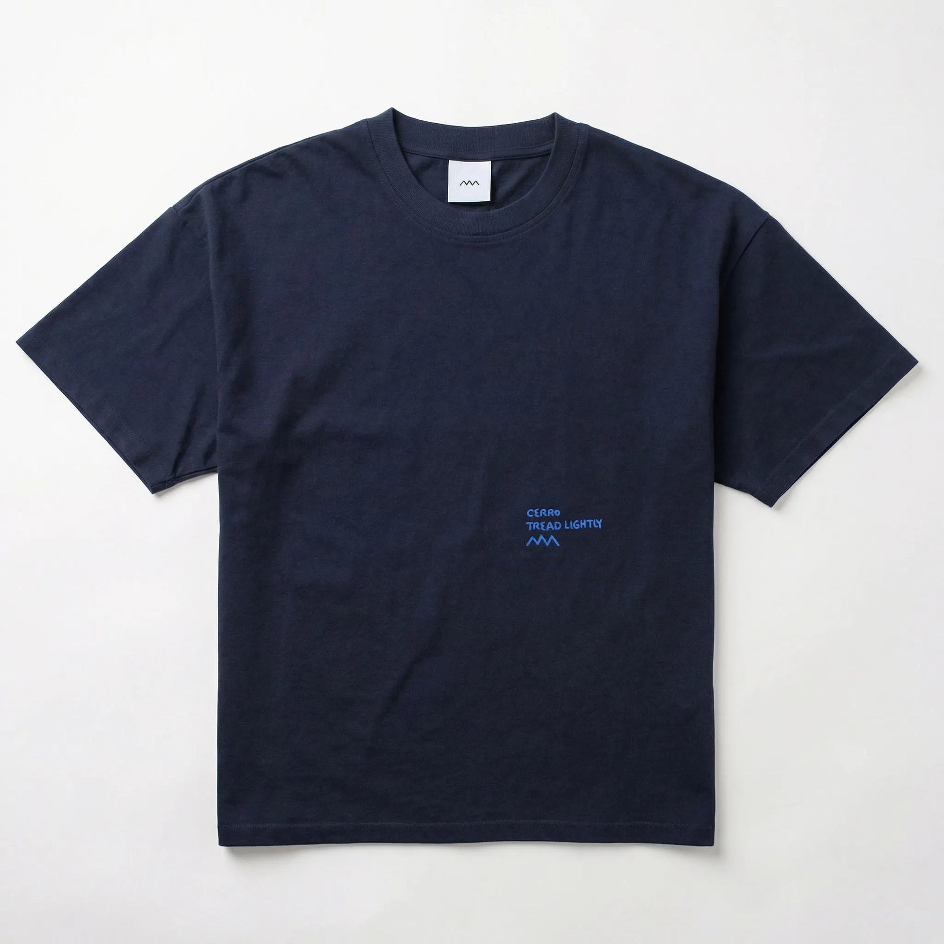 Navy blue t-shirt with a small logo on a light gray background