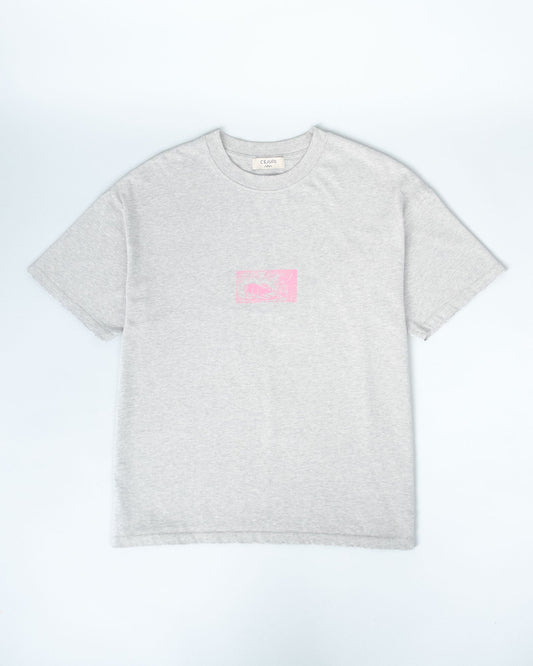 A light heather gray short-sleeve crewneck t-shirt with a small pink graphic box printed on the center chest, displayed flat against a light gray background.